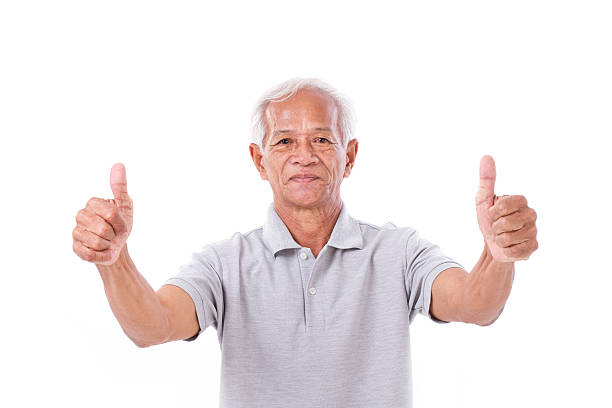 istock senior man giving two thumbs up 475042176