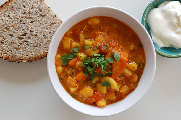 istock bean soup, sour cream and bread 475042304