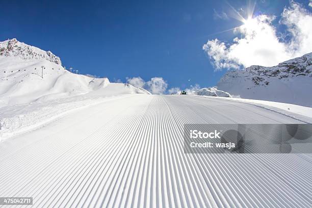 Perfectly Groomed Empty Ski Piste Stock Photo - Download Image Now - Blue, Clear Sky, Cold Temperature