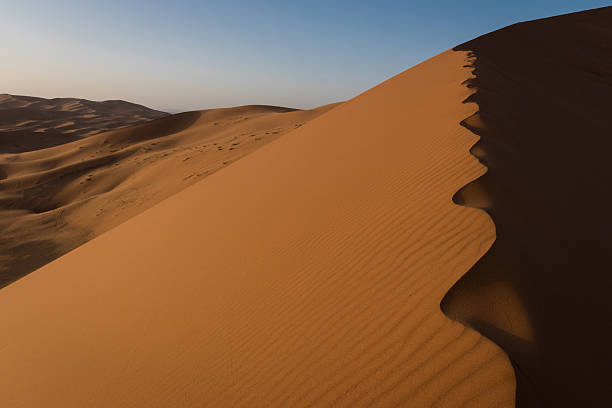 istock Erg Chebbi dunes in Moroccan Sahara Desert at sunrise 475044360