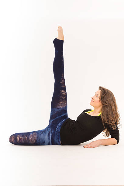 istock skinny girl doing stretching legs 475044809