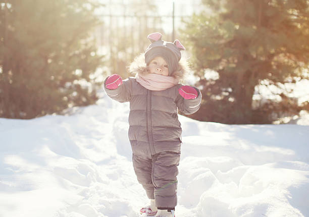 istock Child walking in the forest, sunny winter day 475049348