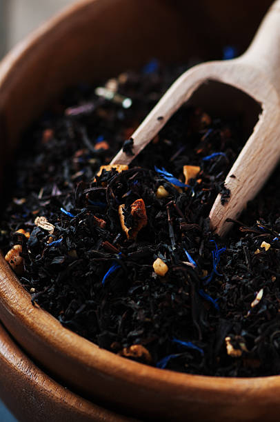 istock Raw black tea on the wooden table, selective focus 475049976