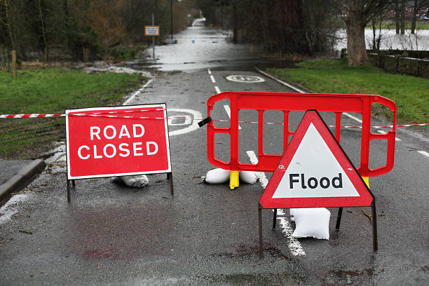 istock Road closed and flood sign 475051091