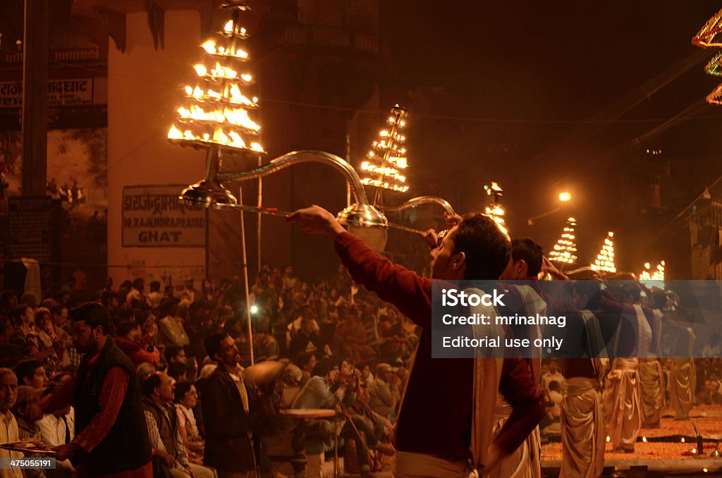 Hindu priest performing religious Ganga Aarti Varanasi, India - February 6, 2014: Hindu priest performing religious Ganga Aarti ritual (Ganges puja) Aarti - Praying Stock Photo