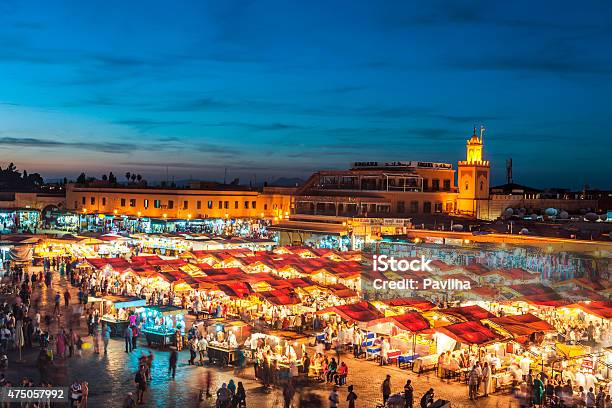 Evening Djemaa El Fna Square With Koutoubia Mosque Marrakech Morocco Stock Photo - Download Image Now