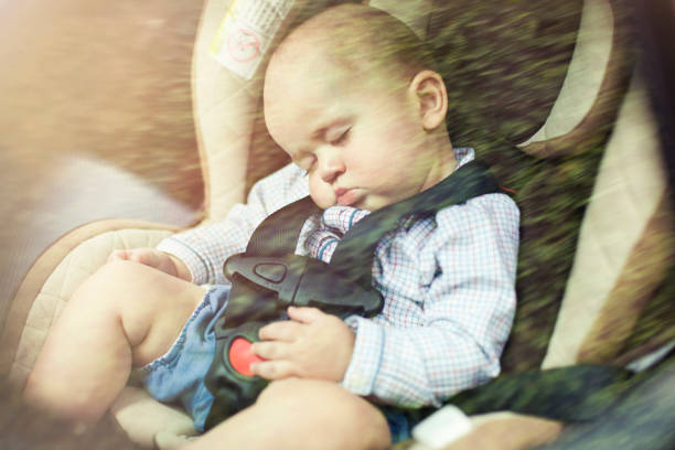 istock Baby sleeping in car 475058000