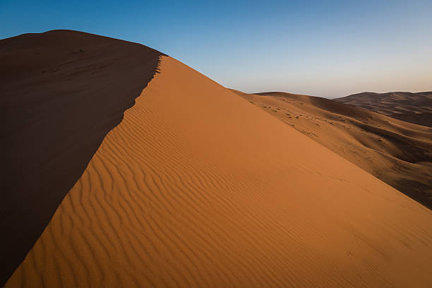 istock Erg Chebbi dunes in Moroccan Sahara Desert at sunrise 475058330