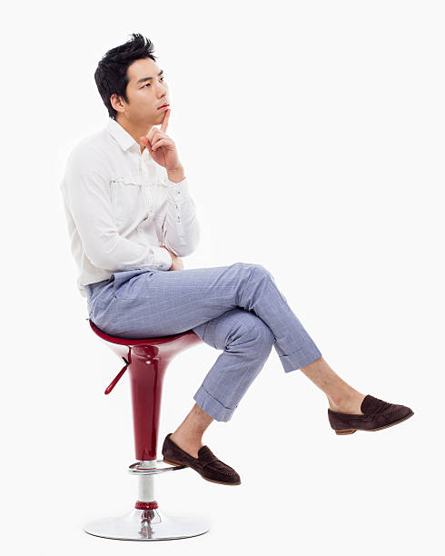 istock Young Asian man thinking on the chair. 475058913