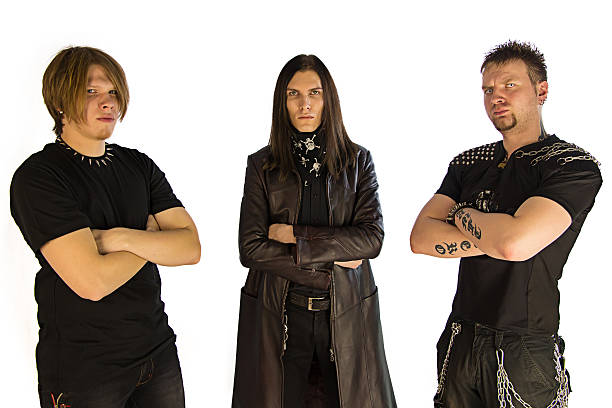 Metal band Three guys metal band in black - isolated photo performance group photos stock pictures, royalty-free photos & images