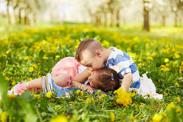istock Boy kissing a girl 475060980