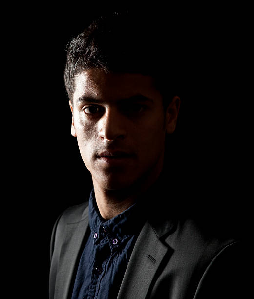 istock Handsome Arab man in black suit 475064616