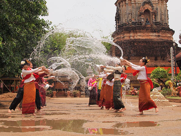 songkran festival Chiangmai,Thailand – May 2, 2010: songkran festival that people go to the temple and splashing water to each other for celebration. buddhist new year stock pictures, royalty-free photos & images