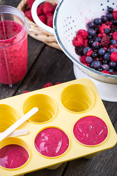 istock filling ice cream moulds with homemade juice 475068302