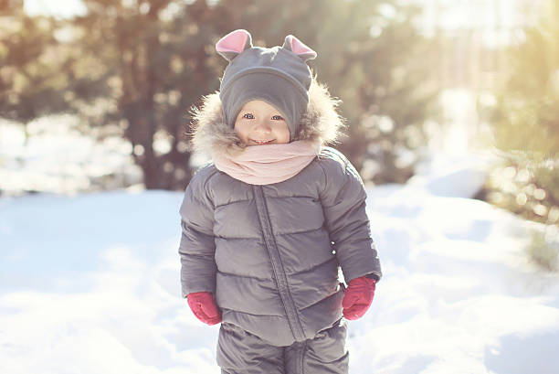 istock Happy smiling child walking in sunny winter day 475068854