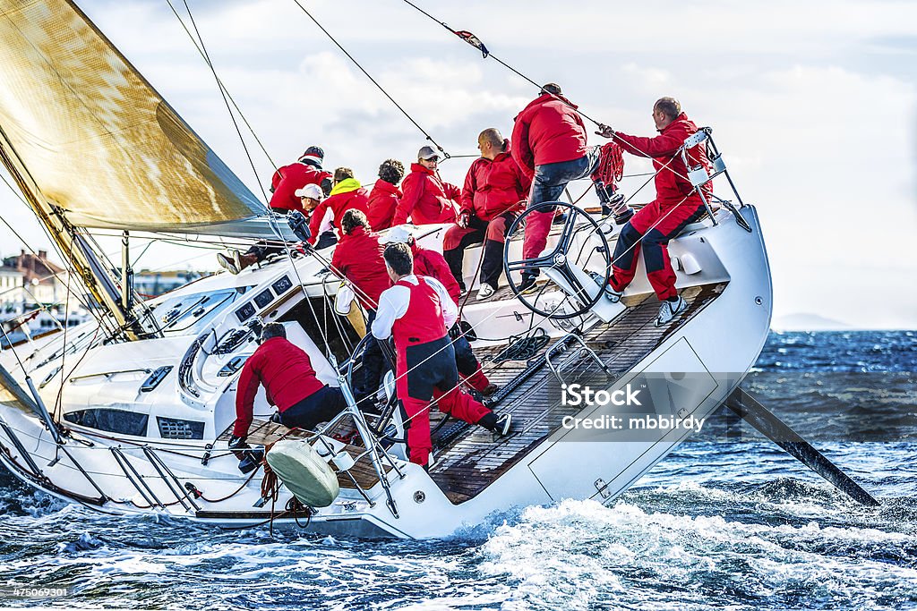 Sailing crew on sailboat during regatta Sailboat Stock Photo