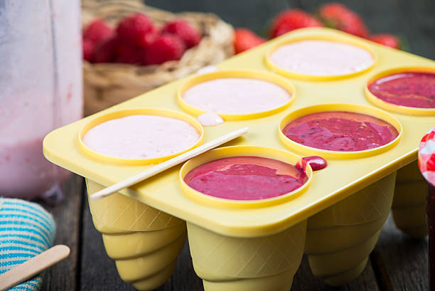 istock filling ice cream moulds with homemade juice 475069644