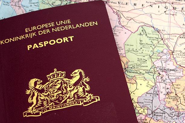 passport dutch passport on a map berk stock pictures, royalty-free photos & images