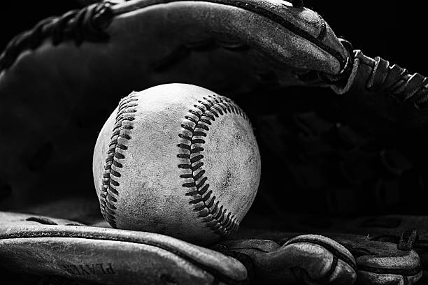 Baseball glove with a ball Baseball glove with ball, black & white. base sports equipment photos stock pictures, royalty-free photos & images