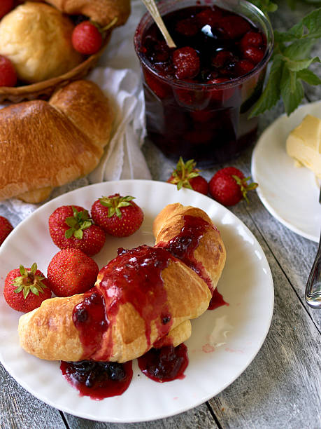 istock Breakfast with croissant,  berry jam and butter 475070069