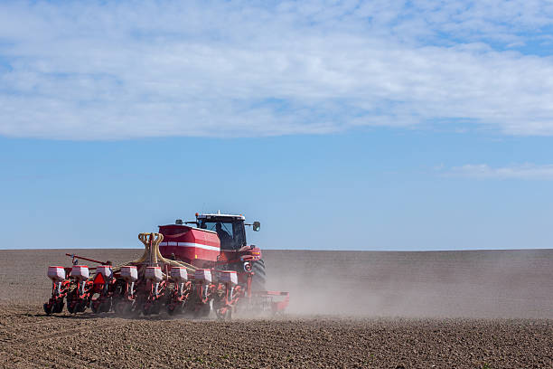istock Tractor harrowing the field 475071714