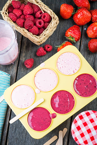 istock filling ice cream moulds with homemade juice 475072320