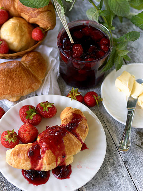 istock Breakfast with croissant,  berry jam and butter 475074365