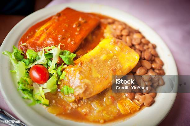 Tamales With Green And Red Chili Salsa And Beans Stock Photo - Download Image Now - Chicken Tamale, Green Chili Pepper, 2015
