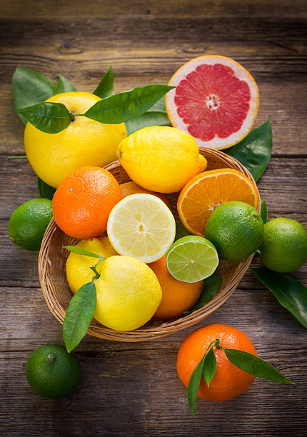istock Citrus fruits in the basket on the rustic table 475076552