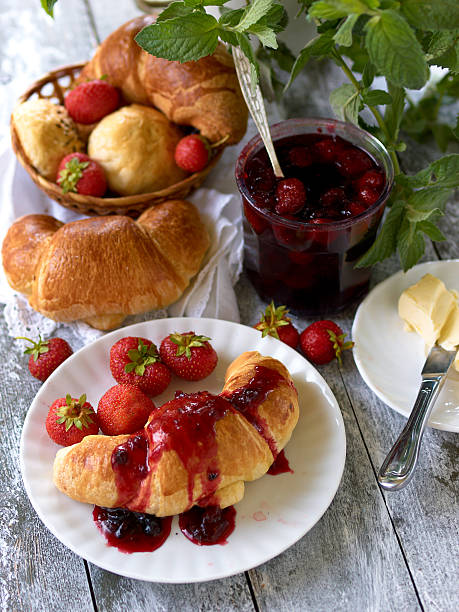 istock Breakfast with croissant,  ralls, berry jam and butter 475077397