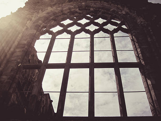 Holyrood Abbey is a ruined abbey of the Canons Regular in Edinburgh, Scotland. The abbey was founded in 1128 by King David I. During the 15th century, the abbey guesthouse was developed into a royal residence, and after the Scottish Reformation the Palace of Holyroodhouse was expanded further. The abbey church was used as a parish church until the 17th century, and has been ruined since the 18th century. The remaining walls of the abbey lie adjacent to the palace, at the eastern end of Edinburgh's Royal Mile. The site of the abbey is protected as a scheduled monument.