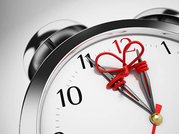 Red rope connects hour and minute hands of the clock preventing time shifting.