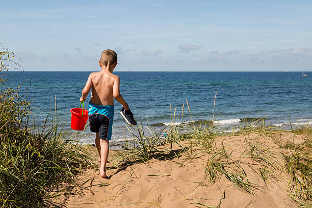 istock Boy with beach toys 475078598