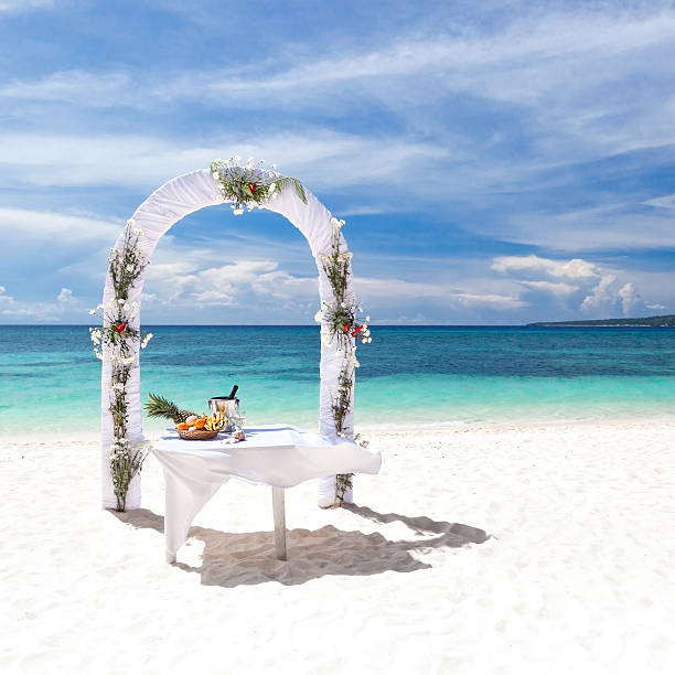 istock Beautiful wedding arch on tropical beach 475084135
