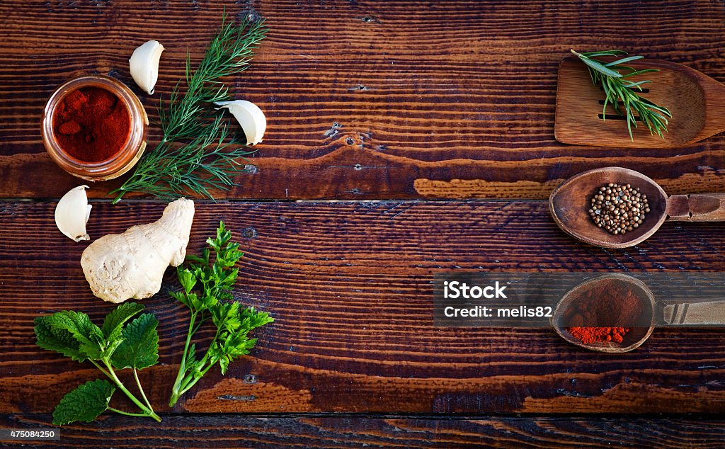 Spices and herbs on wooden table. Top view 2015 Stock Photo