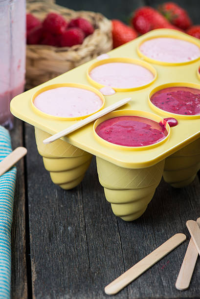 istock filling ice cream moulds with homemade juice 475084410