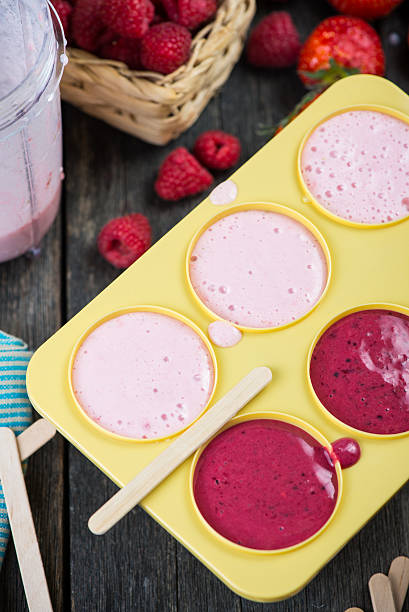 istock filling ice cream moulds with homemade juice 475084594