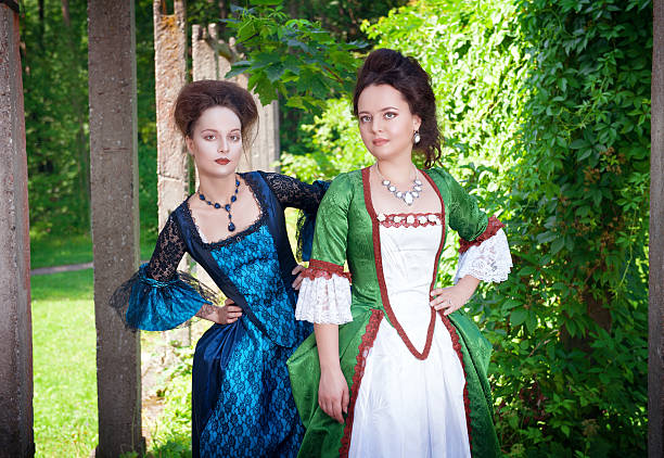 istock Two young beautiful women in long medieval dresses 475085320