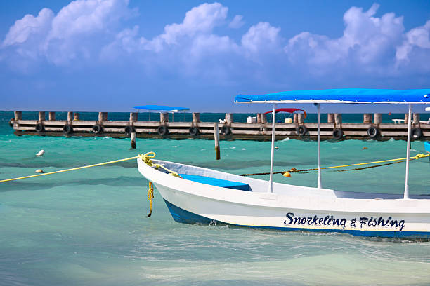 istock fishing and snorkeling boat in marina 475086097