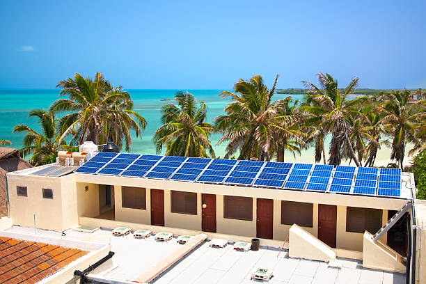 building with a solar panel on the Isla Contoy, Mexico birdeye view on the beach with a building with a solar panel on the Isla Contoy, Mexico contoy island photos stock pictures, royalty-free photos & images