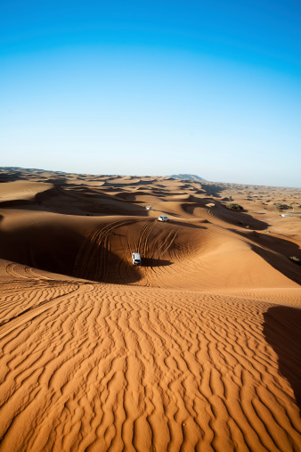 A four by four driving in the United Arab Emirate of Dubai on a jeep safari through the desert. You will really get the feeling of being in the middle of nowhere.