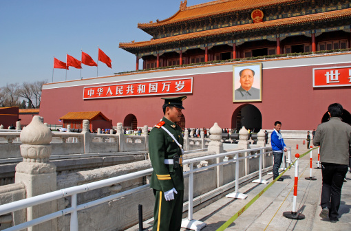 Beijing, China - March 25, 2010: A soldier guards the main entrance of Tiananmen Gate Of Heavenly Peace with Mao portrait at March 25, 2010 in Beijing, China.