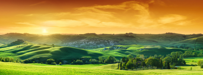 Idyllic landscape - Green fields in Tuscany at sunset ( Panorama )