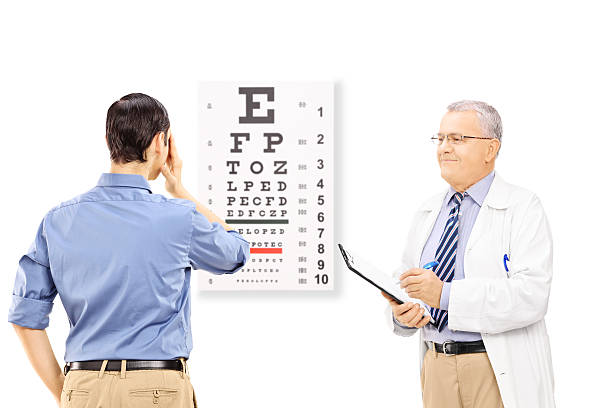 istock Young male patient taking eyesight test and an optician holding 475096067