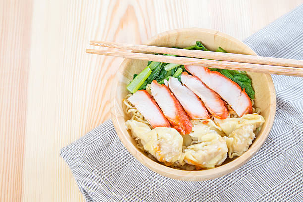 istock bowl of noodles with pork dumpling and vegetables 475096344