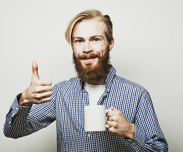 istock man with a cup of coffee 475097310