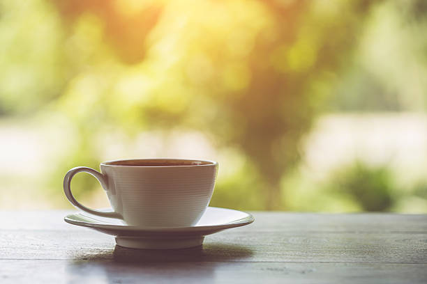 istock White coffee cup on the table at morning time 475099660
