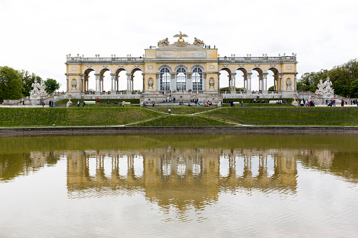 Vienna, Austria - May 1, 2015: Tourists are visiting the Gloriette in the former imperial summer residence known as Schonbrunn Palace.