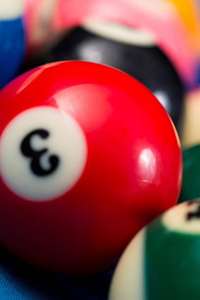 istock Close-Up Of Pool Balls On Blue Table 475100437
