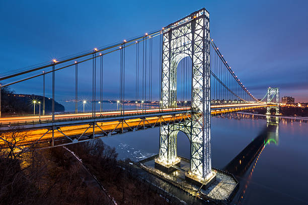 George Washington Bridge at dusk George Washington Bridge fully illuminated to celebrate the 2014 American Football "Big Game" hosted by New Jersey and New York gwb stock pictures, royalty-free photos & images